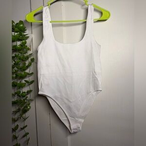 a new day White Bodysuit